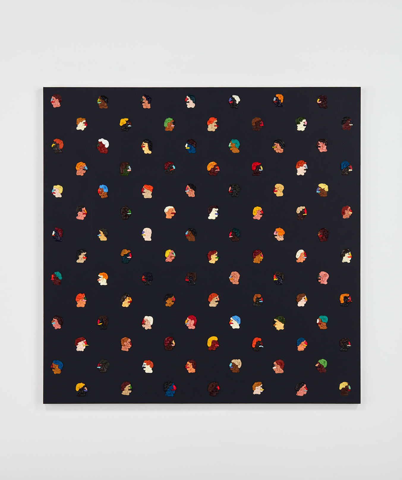 In this square painting, there are about 100 small profile portraits on a black background. The paint that makes up the portraits is thick while the background is flat.