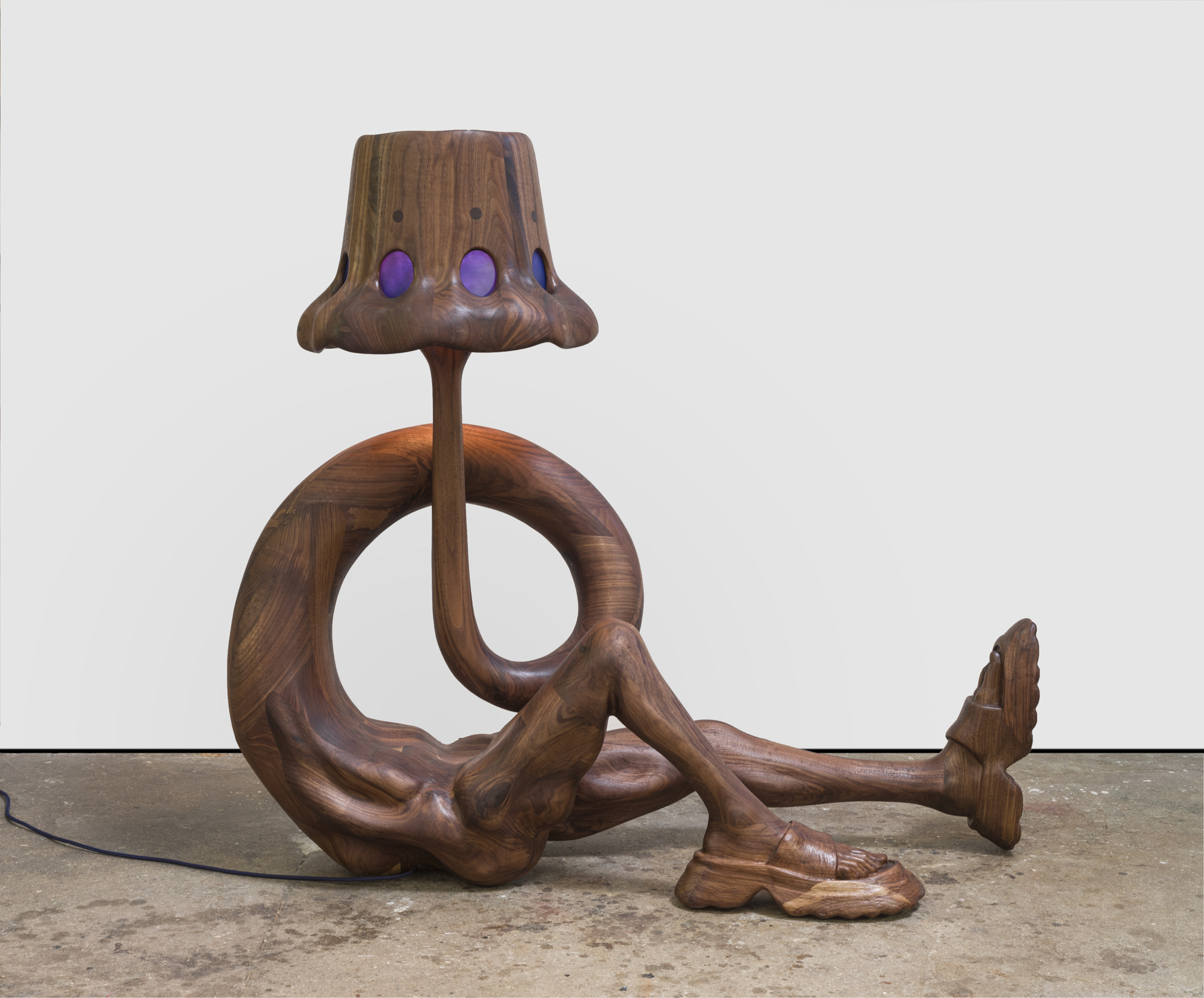 A wooden anthropomorphic lamp