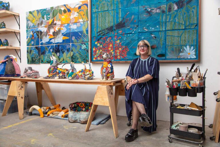 Artist Emily Marchand in seated in her studio in Los Angeles, CA (2024).